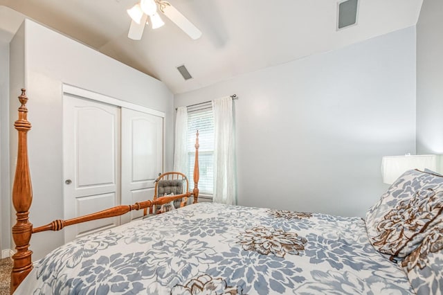 bedroom with carpet flooring, a closet, lofted ceiling, and ceiling fan