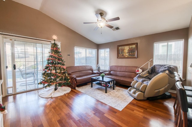 living room with hardwood / wood-style flooring, ceiling fan, and a wealth of natural light