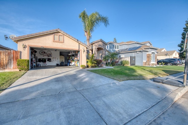 view of front of property featuring a garage and a front lawn