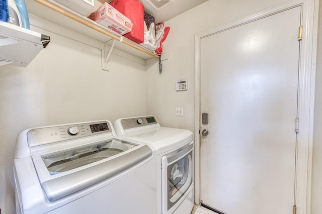 washroom with separate washer and dryer