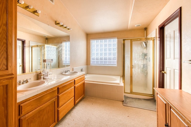 bathroom with separate shower and tub and vanity