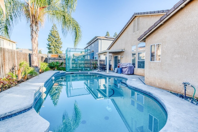 view of pool featuring grilling area