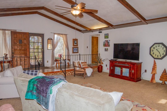 carpeted living room with ceiling fan and lofted ceiling with beams