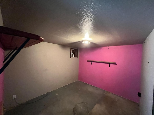 basement featuring a textured ceiling