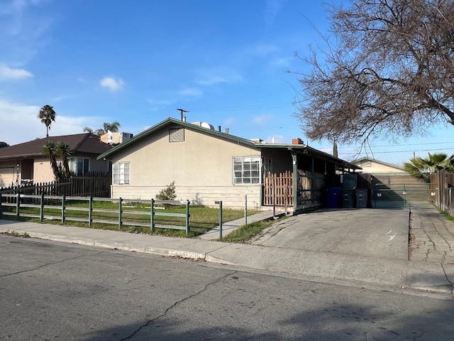 view of front of property with a carport