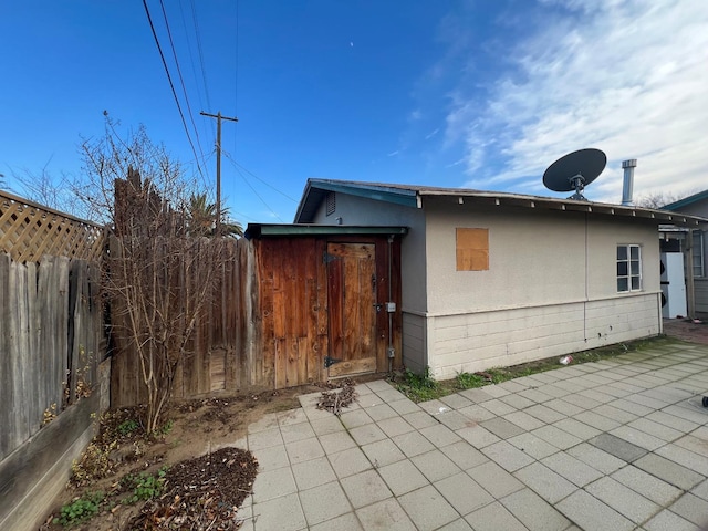 view of home's exterior with a patio area