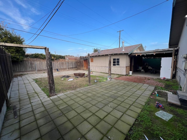 view of patio / terrace featuring a fire pit