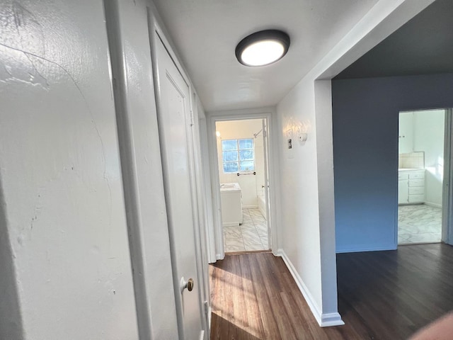 hallway featuring dark hardwood / wood-style flooring