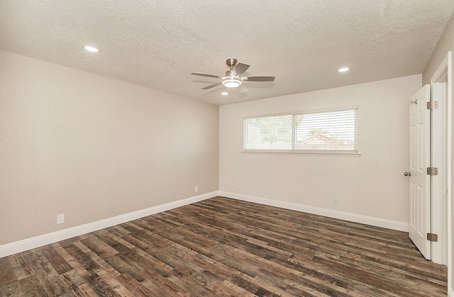 spare room featuring ceiling fan, a textured ceiling, and dark hardwood / wood-style flooring