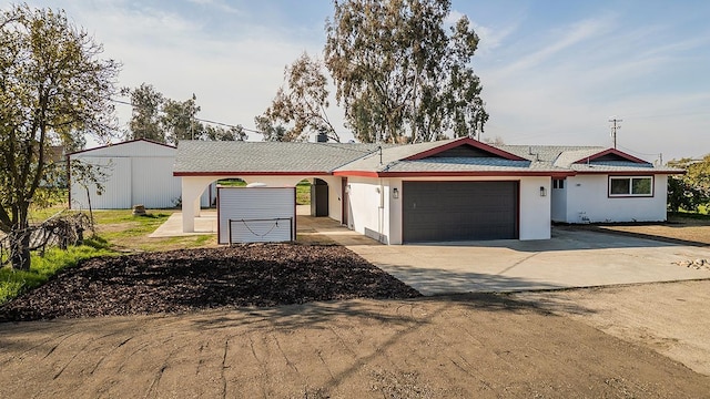 single story home with a garage