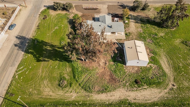 birds eye view of property with a rural view