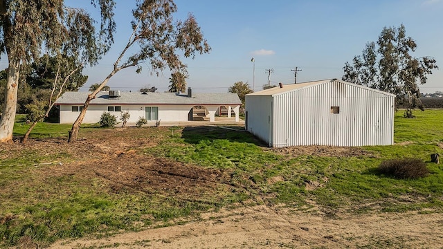 12027 S Brawley Ave, Caruthers, CA 93609 - back of property with a yard and an outbuilding