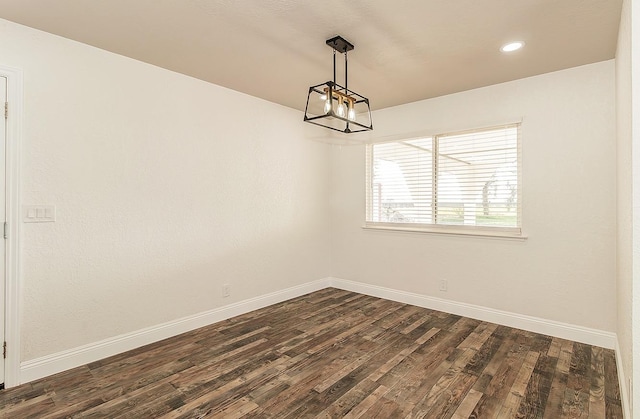 empty room with dark hardwood / wood-style floors