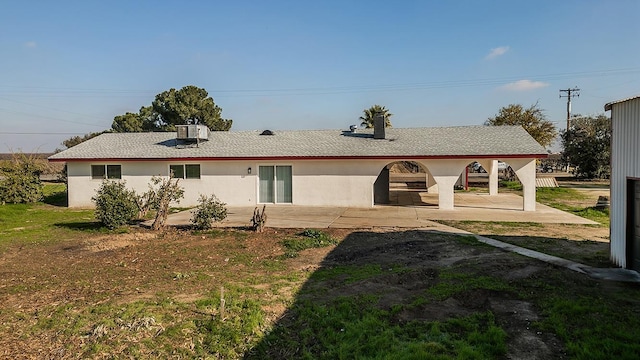 12027 S Brawley Ave, Caruthers, CA 93609 - back of house featuring a patio and stucco siding