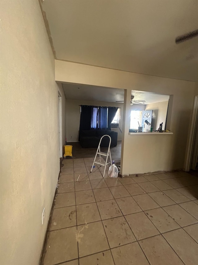 kitchen with tile patterned floors and ceiling fan