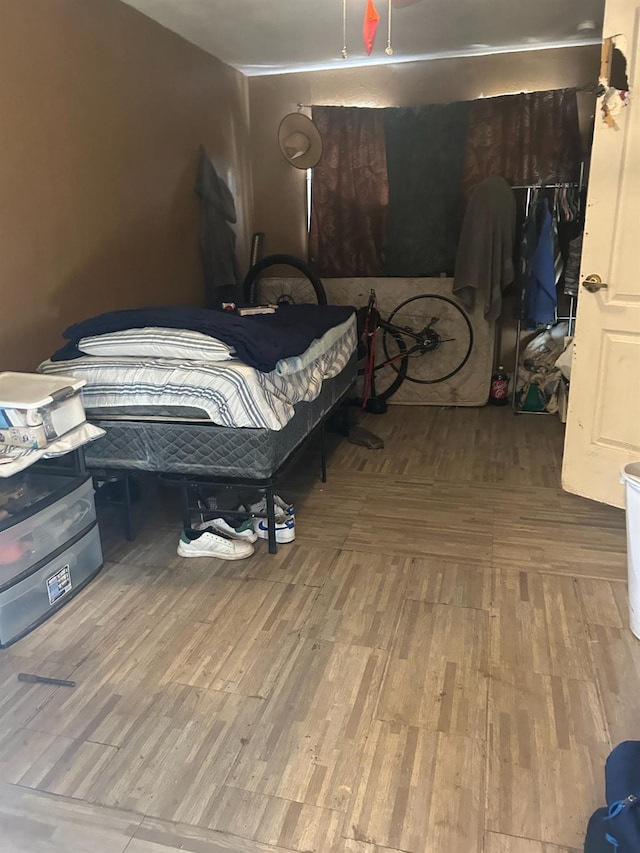 bedroom featuring wood-type flooring