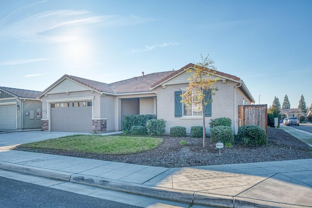 ranch-style home with a front yard, central AC, and a garage