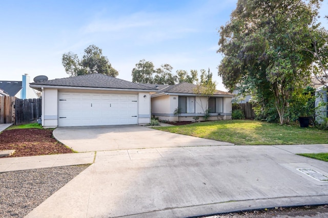 ranch-style house featuring a garage and a front yard