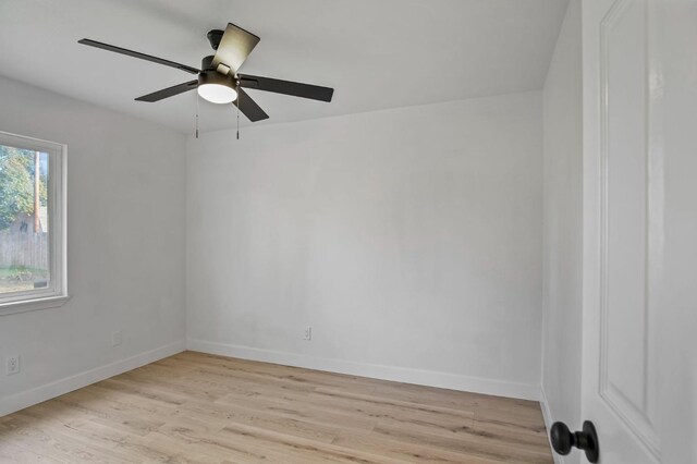 empty room featuring light wood-type flooring and ceiling fan