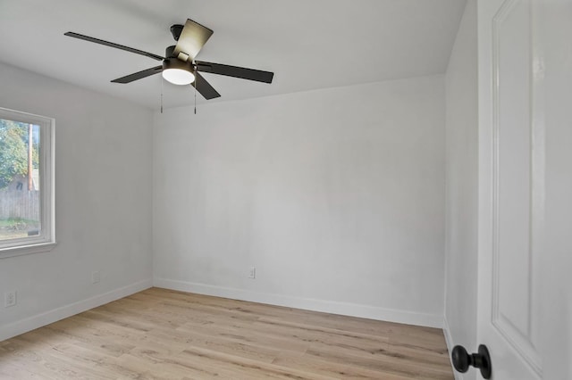 unfurnished room with ceiling fan, light wood-type flooring, and baseboards