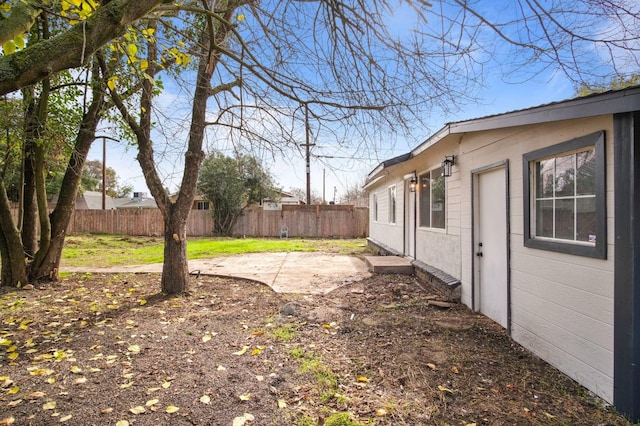 view of yard featuring a patio area and fence