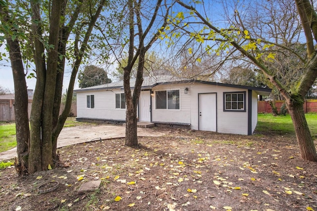 view of front of home featuring fence