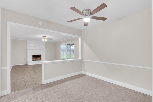 unfurnished living room featuring carpet, ceiling fan, and a fireplace