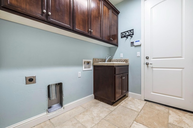 10810 N Matus Ave, Fresno, CA 93730 - washroom with baseboards, washer hookup, electric dryer hookup, and cabinet space