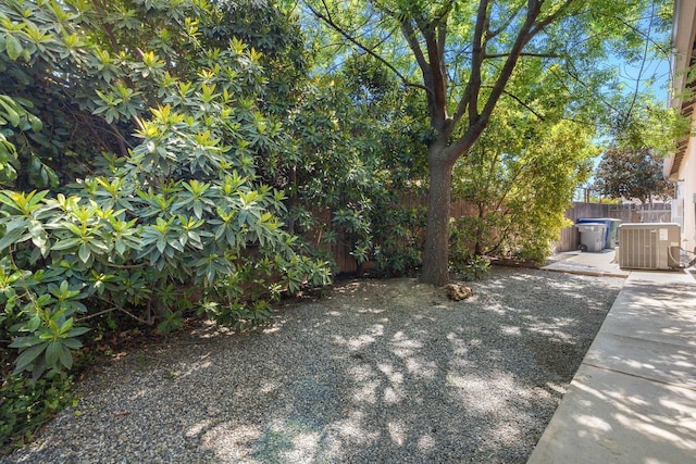 10810 N Matus Ave, Fresno, CA 93730 - view of yard featuring central air condition unit, fence, and a patio