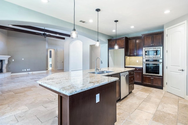 10810 N Matus Ave, Fresno, CA 93730 - kitchen with a sink, stone tile floors, stainless steel appliances, tasteful backsplash, and visible vents