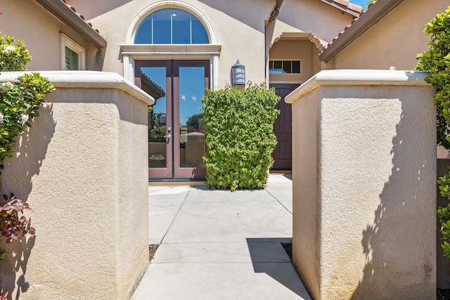 10810 N Matus Ave, Fresno, CA 93730 - view of exterior entry with stucco siding and french doors