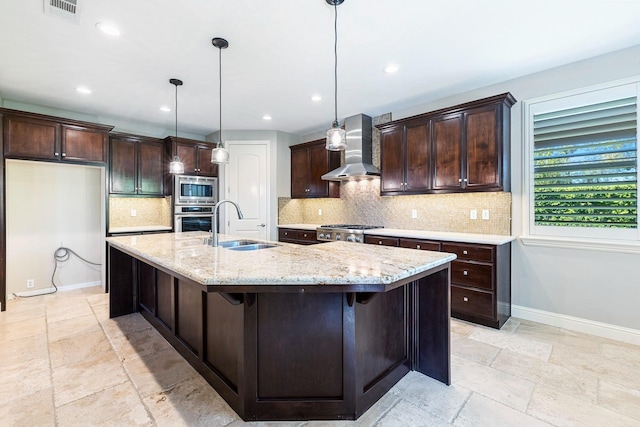 10810 N Matus Ave, Fresno, CA 93730 - kitchen with visible vents, appliances with stainless steel finishes, a sink, stone tile flooring, and wall chimney exhaust hood