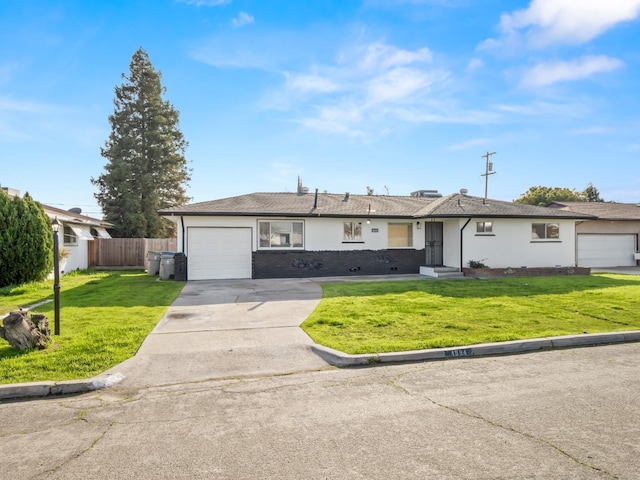 single story home featuring a front yard and a garage