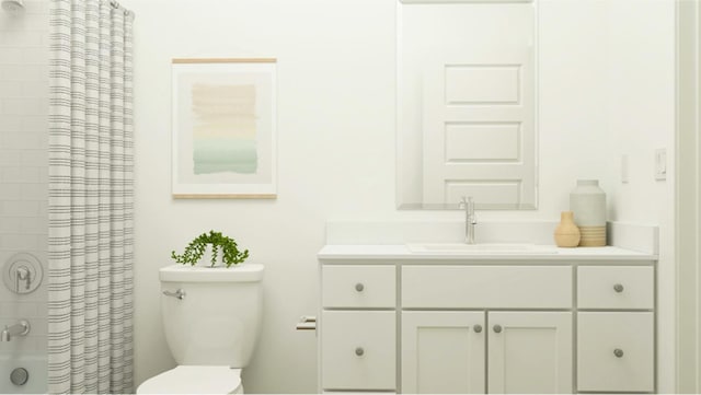 bathroom featuring toilet, vanity, and a shower with curtain