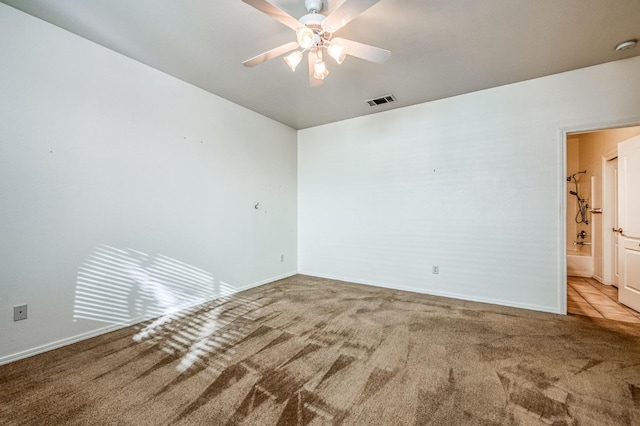 carpeted empty room with ceiling fan