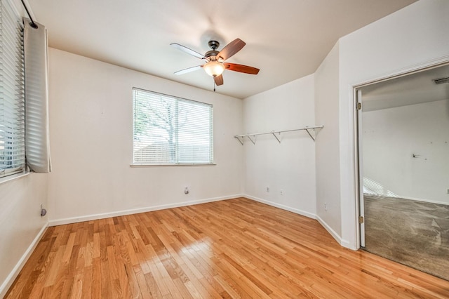 unfurnished bedroom featuring a closet, ceiling fan, and light wood-type flooring