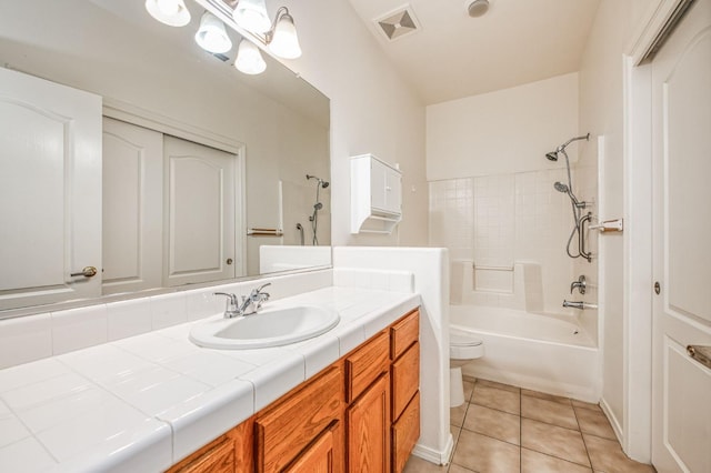 full bathroom featuring toilet, vanity, tile patterned floors, and shower / bathtub combination