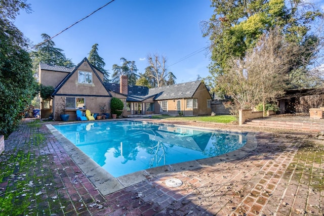 view of pool featuring a patio