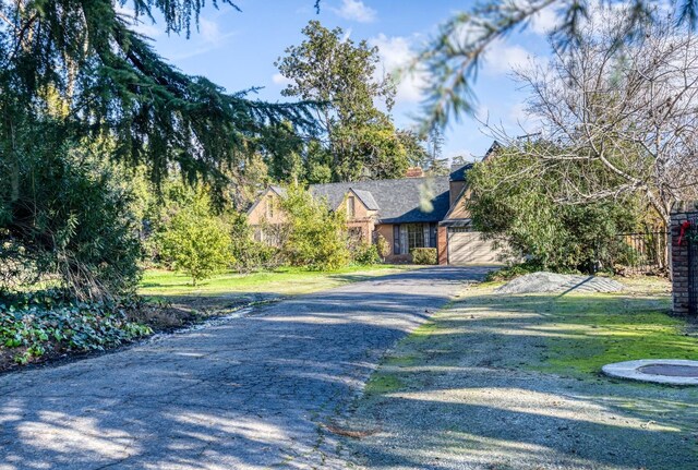 3628 N Van Ness, Fresno, CA 93704 - view of front of house featuring asphalt driveway and a chimney