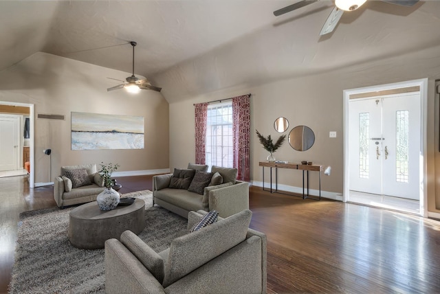 living room featuring dark hardwood / wood-style flooring, ceiling fan, and lofted ceiling