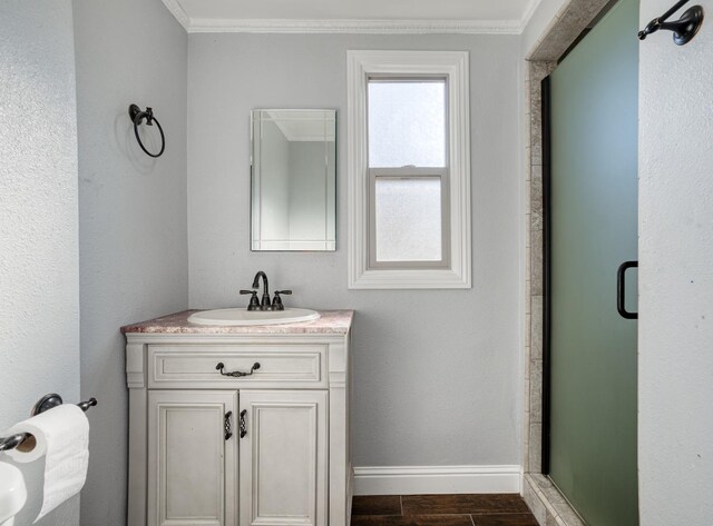 3628 N Van Ness, Fresno, CA 93704 - bathroom featuring a stall shower, vanity, ornamental molding, and wood finished floors