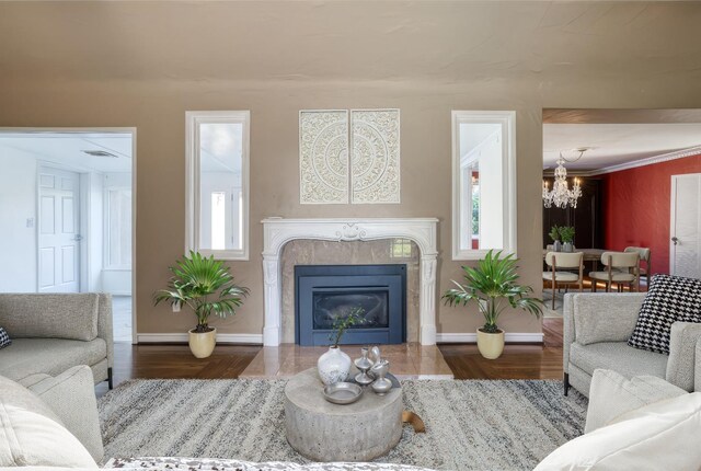 3628 N Van Ness, Fresno, CA 93704 - living area with a chandelier, wood finished floors, healthy amount of natural light, and a fireplace