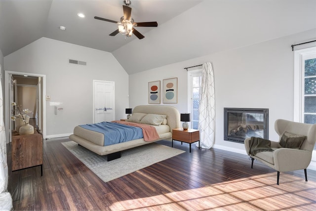 bedroom featuring ceiling fan, dark wood-type flooring, and vaulted ceiling