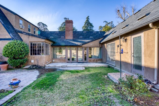 3628 N Van Ness, Fresno, CA 93704 - rear view of house featuring a patio area, a chimney, a lawn, and stucco siding
