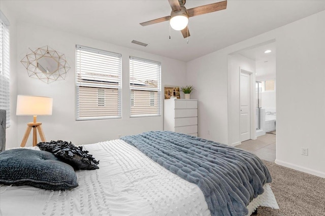 carpeted bedroom featuring connected bathroom and ceiling fan