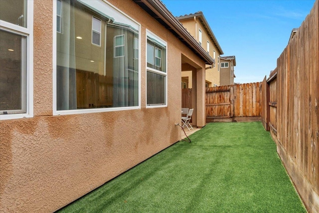 view of property exterior featuring a yard