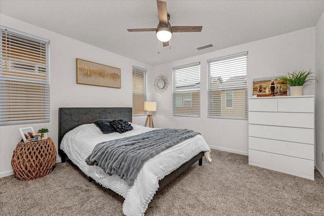 bedroom with ceiling fan and light colored carpet