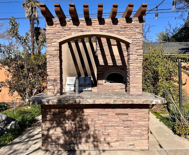 view of patio with area for grilling and grilling area