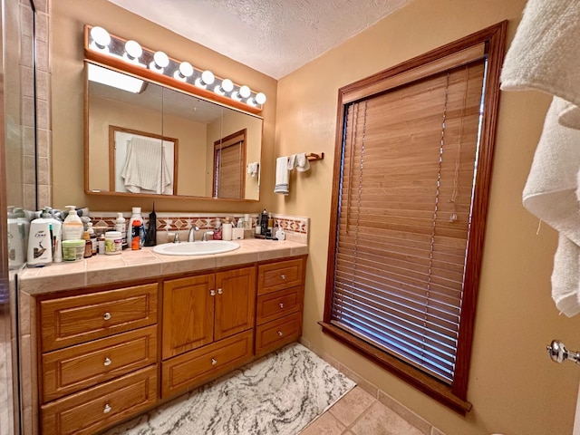 bathroom featuring vanity and a textured ceiling