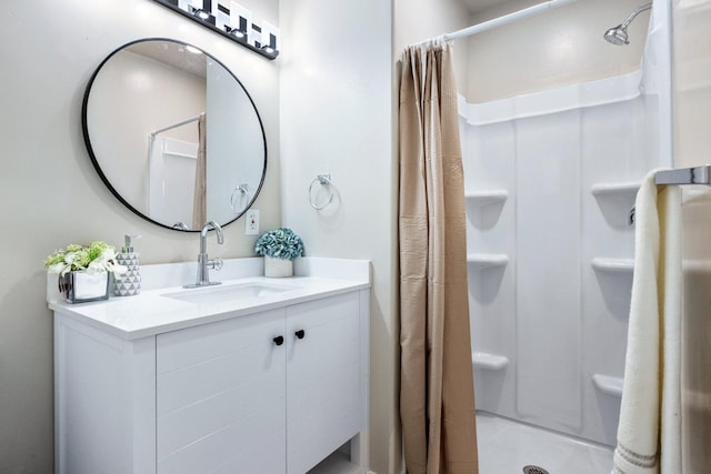 bathroom featuring vanity and curtained shower